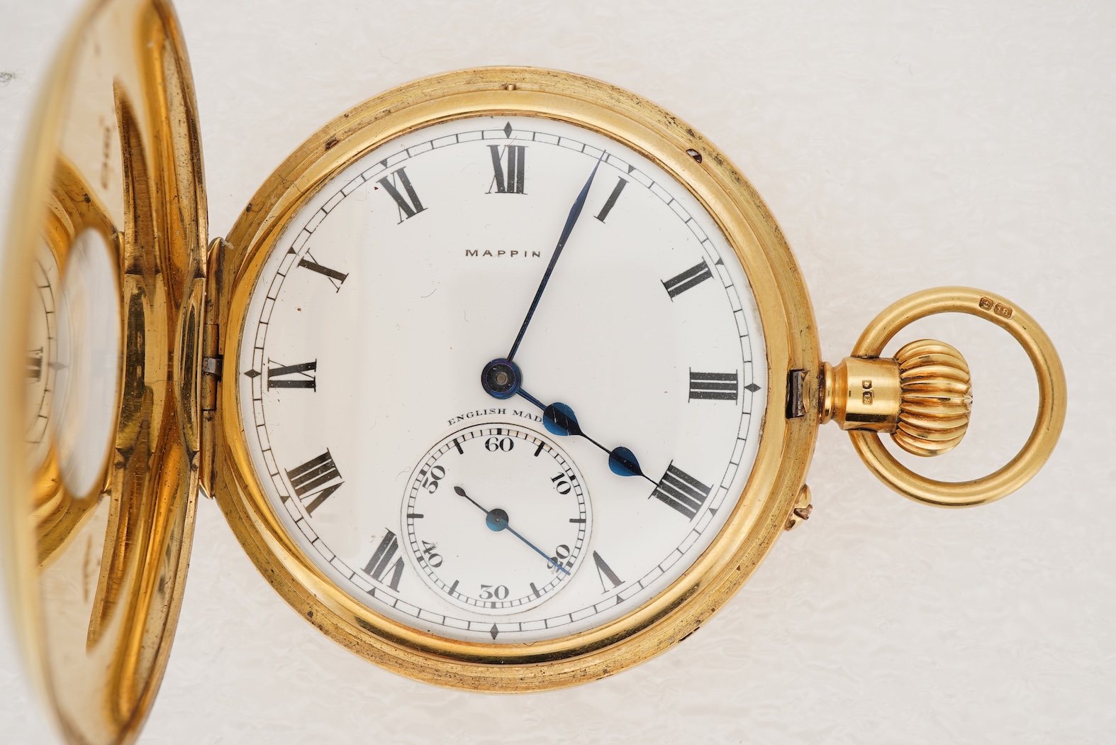 A George V 18ct gold half hunter keyless lever pocket watch, retailed by Mappin